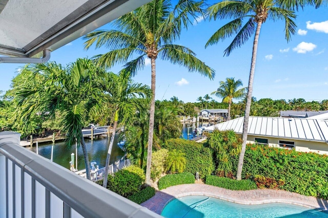 view of pool featuring a water view