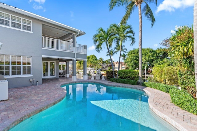 view of swimming pool featuring a patio area