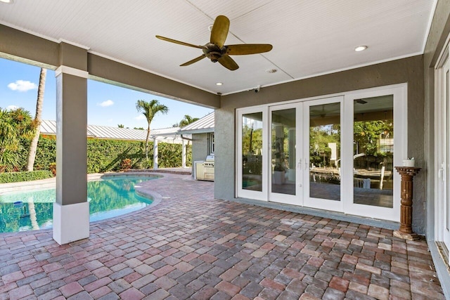 view of swimming pool featuring french doors, ceiling fan, and a patio area