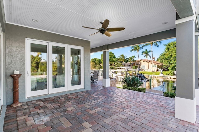 view of patio featuring ceiling fan and french doors