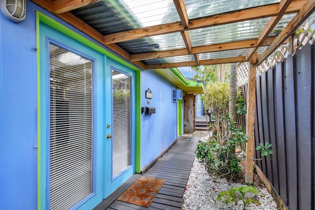 unfurnished sunroom with beamed ceiling