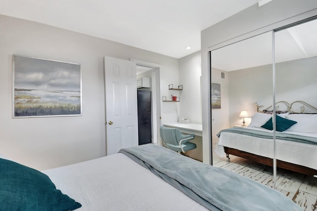 bedroom with a closet and visible vents