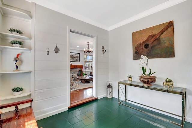 interior space featuring an inviting chandelier and crown molding