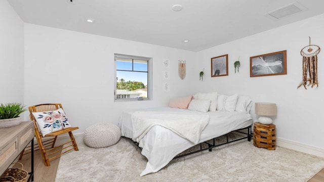 bedroom with light hardwood / wood-style floors