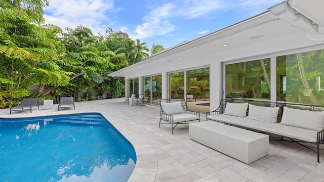 view of swimming pool featuring outdoor lounge area and a patio