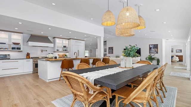 dining space with light hardwood / wood-style flooring