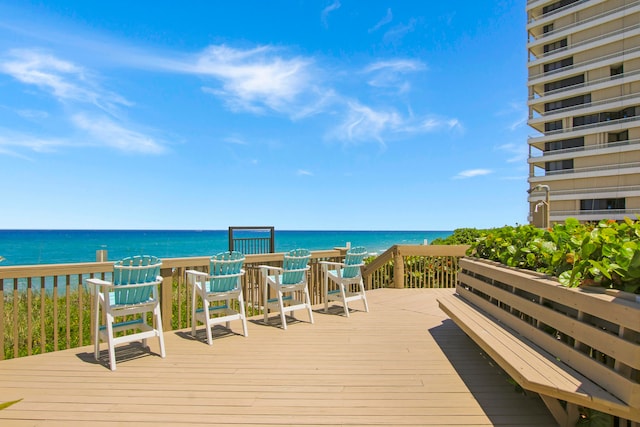 wooden deck with a water view