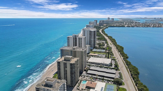 birds eye view of property featuring a view of the beach and a water view