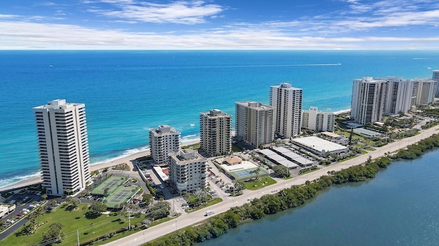 drone / aerial view with a beach view and a water view