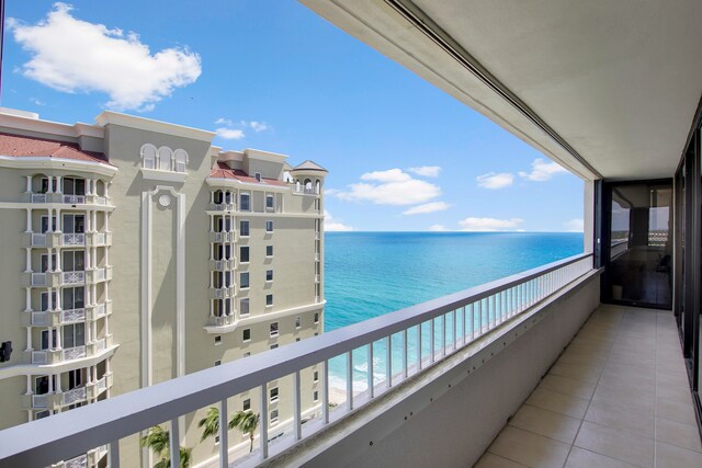 balcony with a view of the beach and a water view