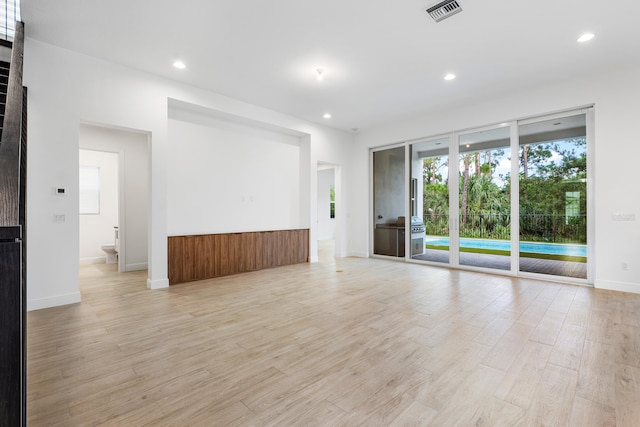 empty room with light hardwood / wood-style floors