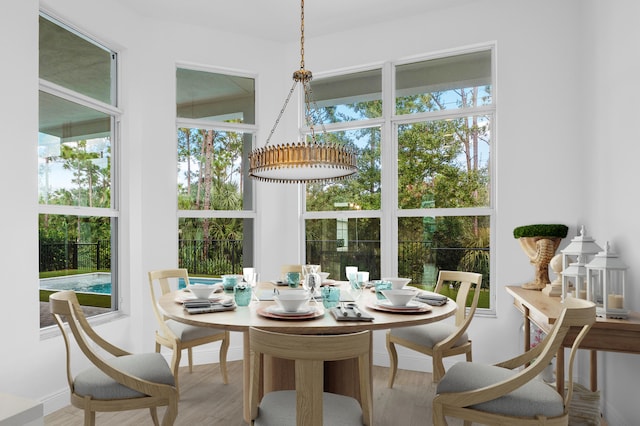 dining area featuring plenty of natural light and light wood-type flooring