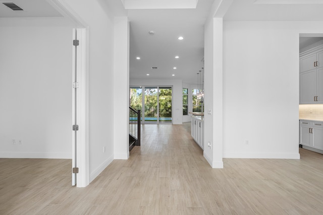 corridor with light wood-type flooring