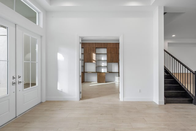 foyer with light hardwood / wood-style floors