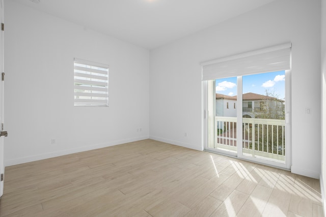 unfurnished room with light hardwood / wood-style floors