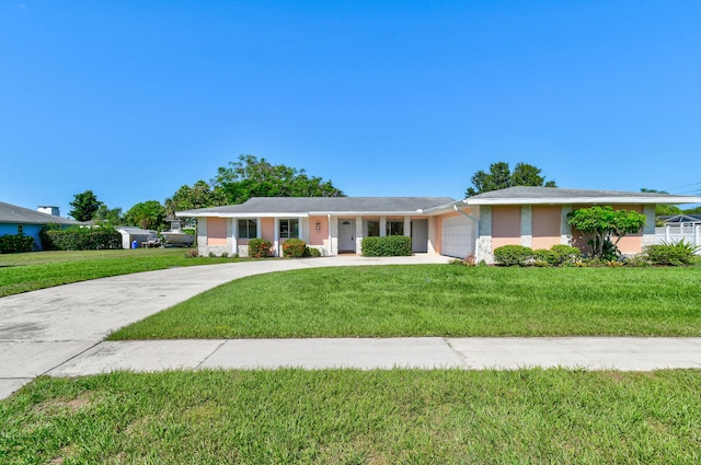 single story home with a front lawn and a garage