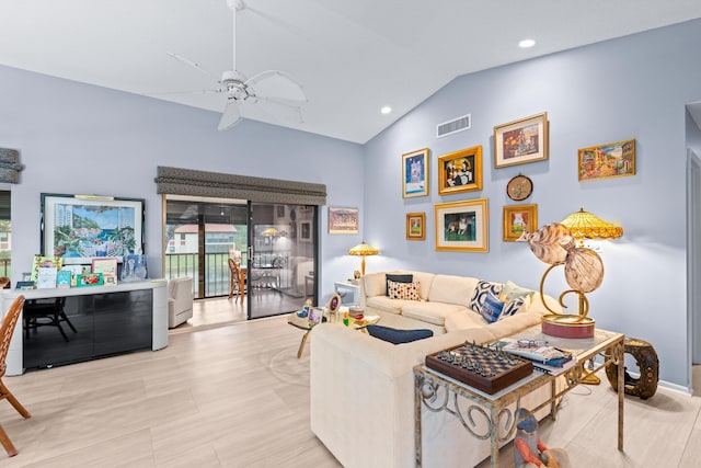 living room with ceiling fan and vaulted ceiling