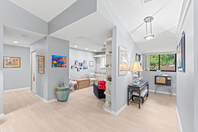 corridor featuring vaulted ceiling