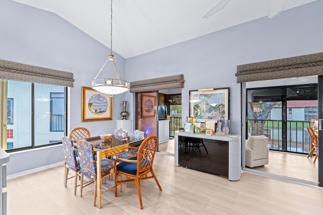 dining space featuring lofted ceiling