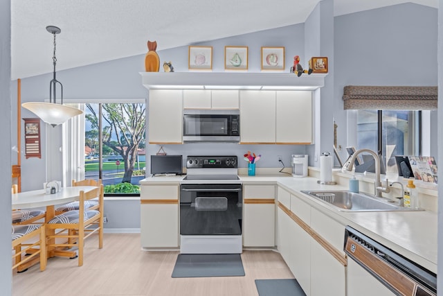 kitchen with white cabinets, sink, dishwashing machine, and white range with electric cooktop