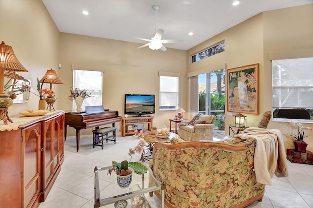 living room with light tile patterned floors and ceiling fan