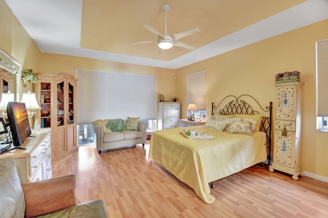 bedroom with light wood-type flooring and ceiling fan