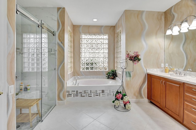 bathroom featuring vanity, tile patterned floors, and plus walk in shower