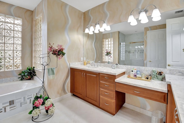 bathroom with vanity, tile patterned flooring, a healthy amount of sunlight, and plus walk in shower