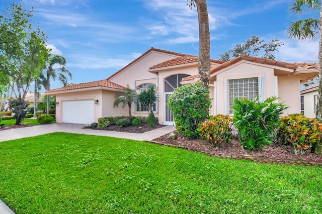 mediterranean / spanish house with a garage and a front yard