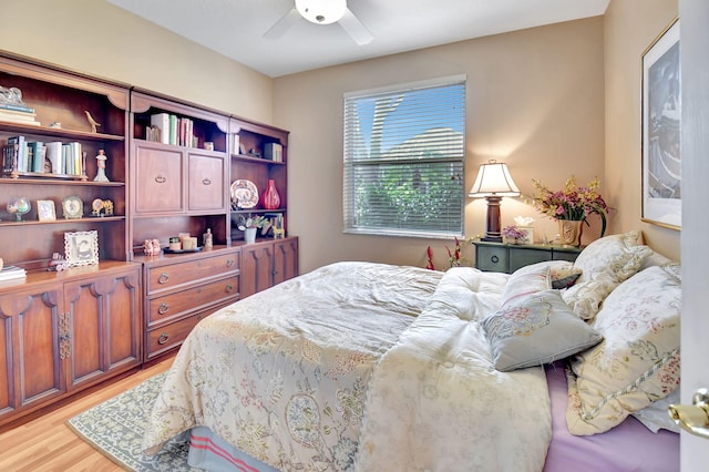 bedroom with light wood-type flooring and ceiling fan