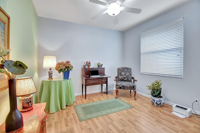 sitting room featuring light hardwood / wood-style floors and ceiling fan