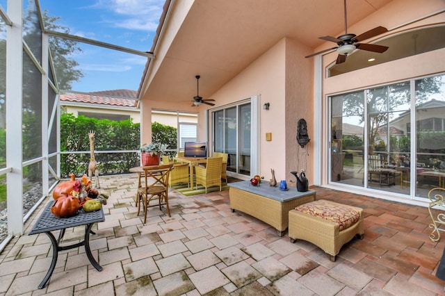 sunroom / solarium featuring vaulted ceiling and ceiling fan