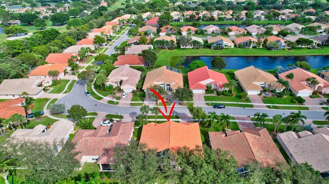 birds eye view of property with a water view