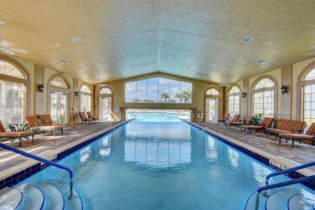 view of swimming pool with a patio and french doors