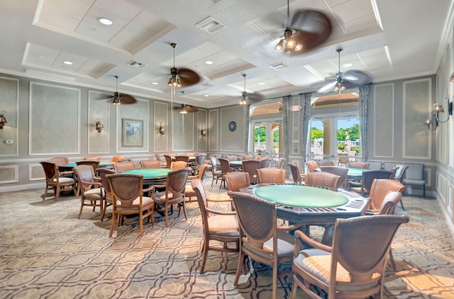 dining area with ceiling fan and coffered ceiling