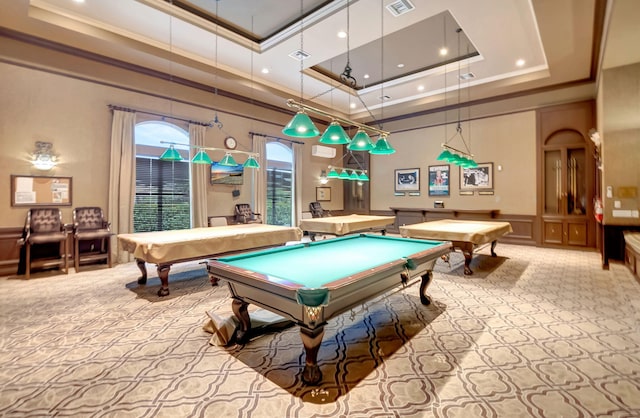 recreation room with pool table, a tray ceiling, light colored carpet, and a towering ceiling