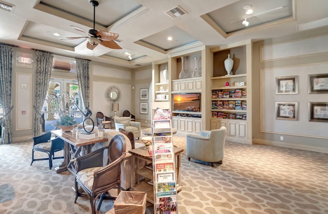 carpeted living room featuring built in shelves, coffered ceiling, ornamental molding, and ceiling fan