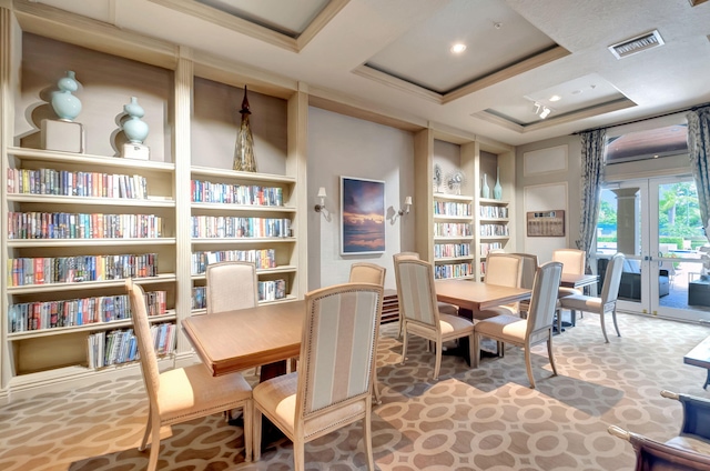 dining area with built in shelves, french doors, carpet floors, and crown molding