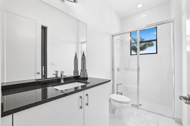 bathroom with a stall shower, toilet, marble finish floor, vanity, and recessed lighting