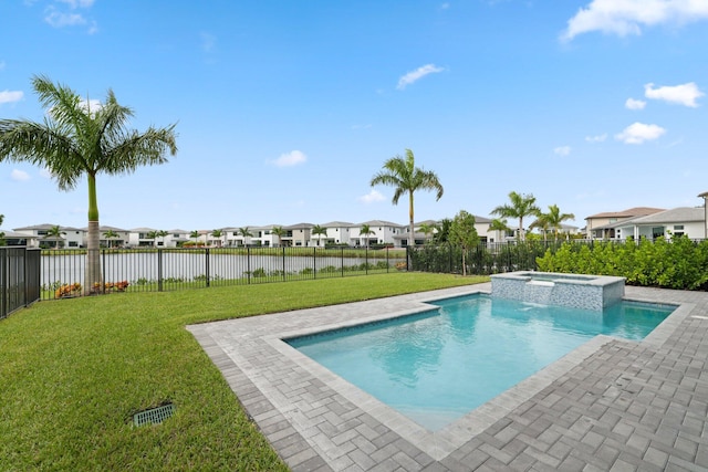 view of swimming pool with an in ground hot tub, a yard, a water view, and a patio