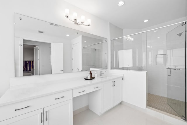 full bathroom featuring a stall shower, visible vents, vanity, and recessed lighting