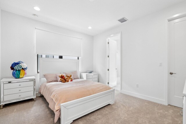 bedroom with recessed lighting, baseboards, visible vents, and light colored carpet