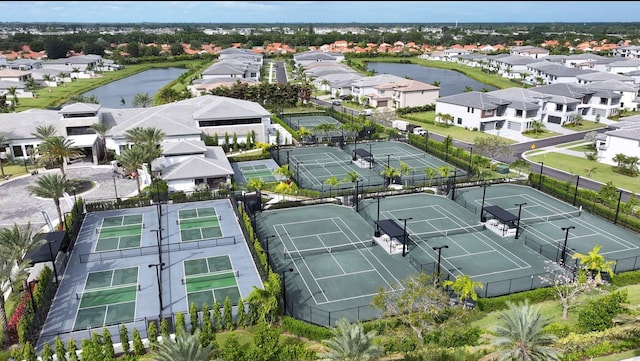 birds eye view of property with a water view and a residential view