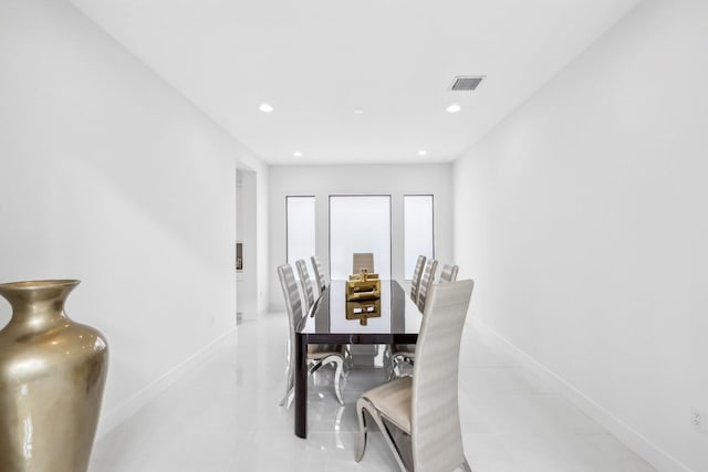 dining space featuring light tile patterned floors, recessed lighting, visible vents, and baseboards