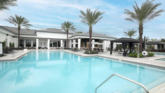 pool featuring a patio area and a gazebo