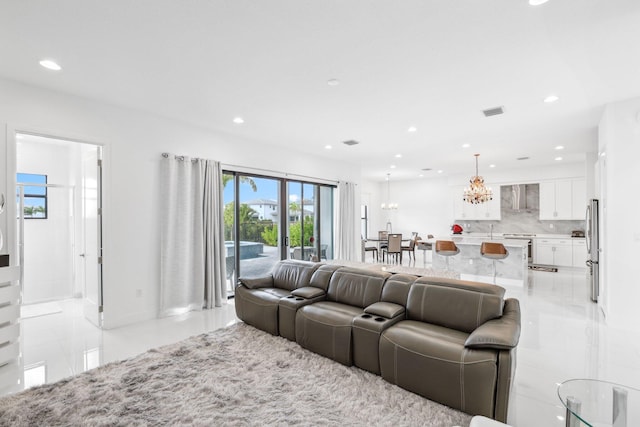 living area with recessed lighting, visible vents, an inviting chandelier, and light tile patterned flooring