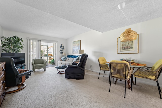 living room with light colored carpet and a textured ceiling