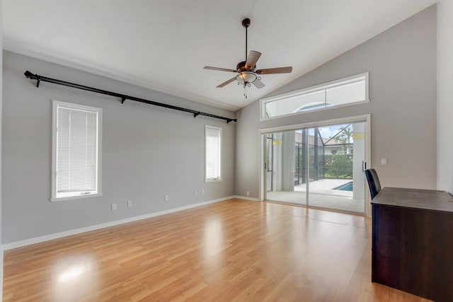 unfurnished living room featuring ceiling fan, lofted ceiling, and light wood-type flooring