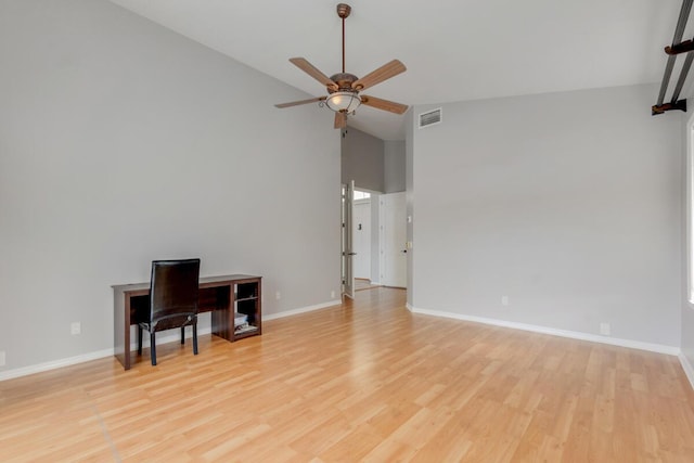 unfurnished room featuring ceiling fan, light hardwood / wood-style floors, and lofted ceiling