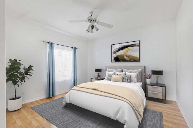 bedroom featuring hardwood / wood-style floors and ceiling fan